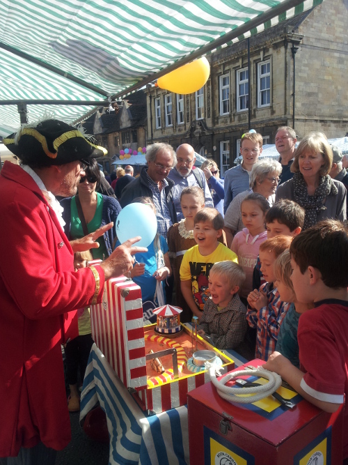 The flea circus performance with the audiance watching amazed
