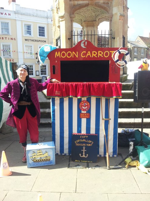The Pirate Puppet Show with a costumed pirate puppeteer