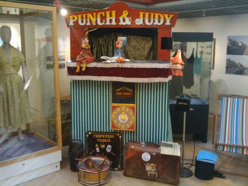 Punch and Judy puppets on the playboard of a puppet booth